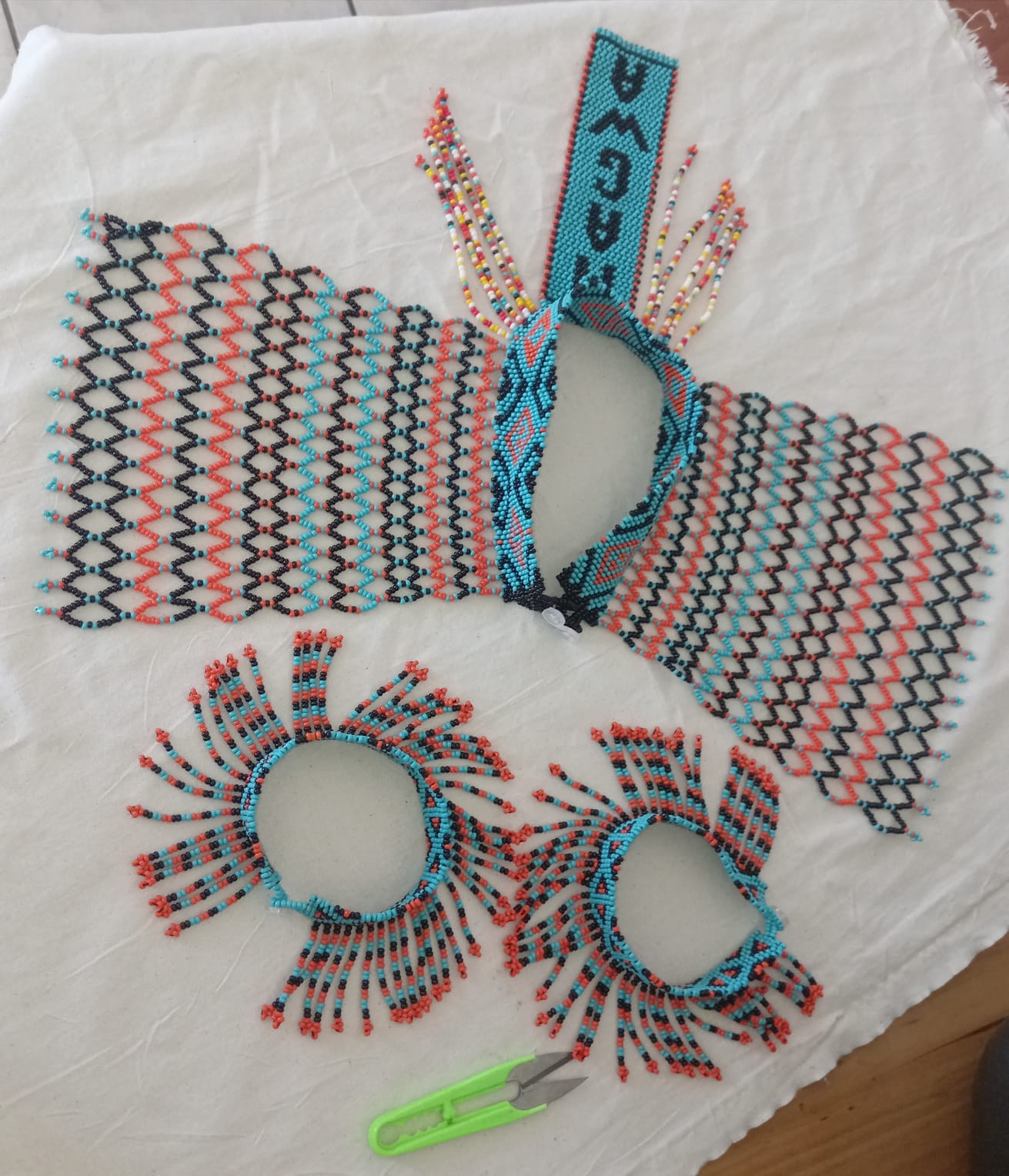 Handcrafted beaded cuffs and woven accessories